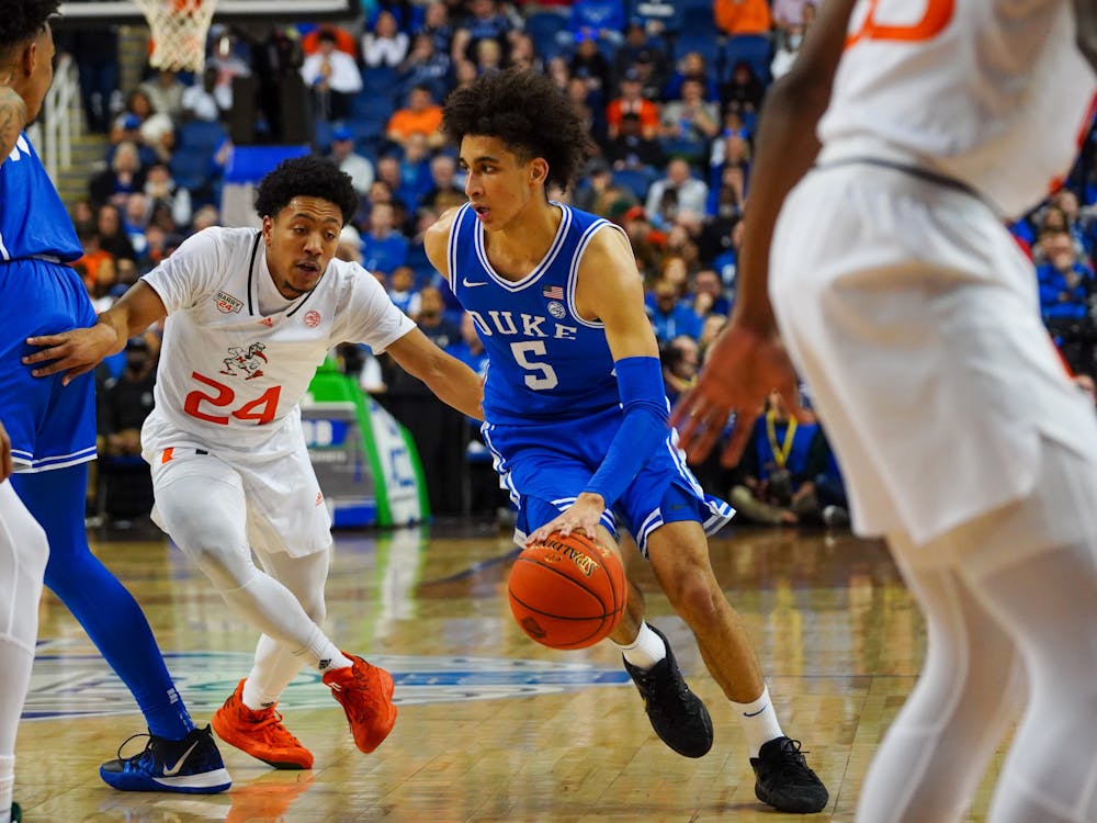 Tyrese Proctor drives with the ball in Duke's ACC tournament win against Miami.