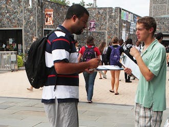 Students register people to vote on the Bryan Center Plaza to get people to the polls on Election Day.