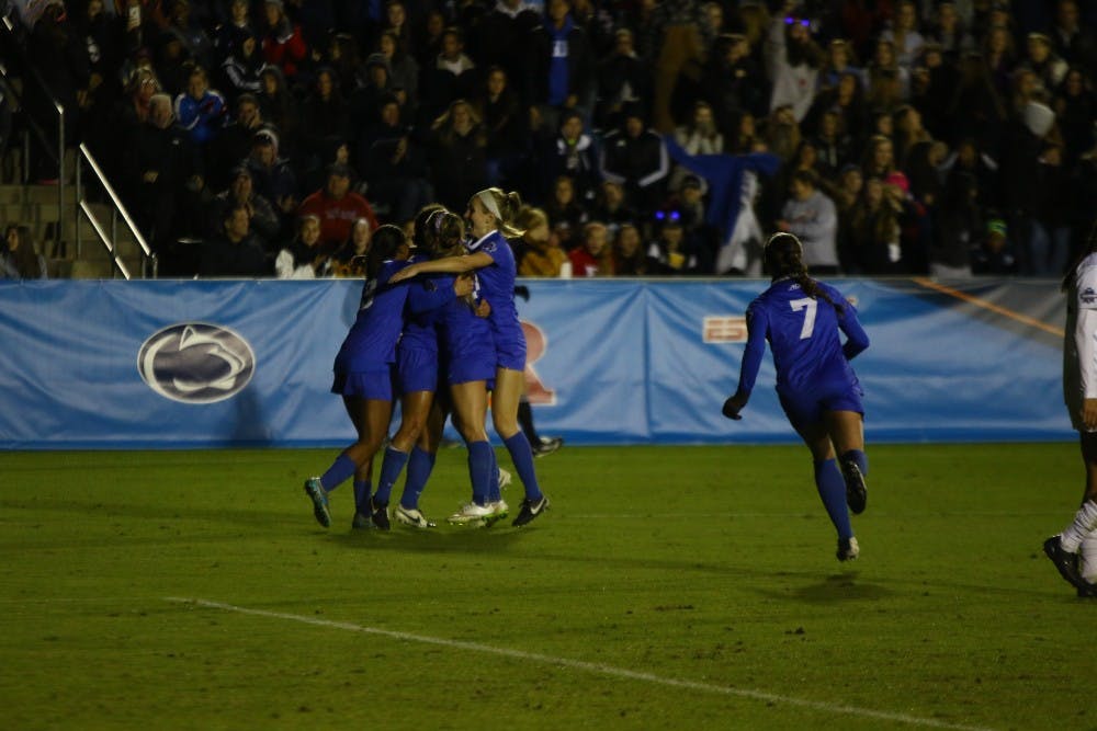 The Blue Devils celebrated Kayla McCoy's first-half goal that sent the Blue Devils past the Seminoles and on to the national title game.