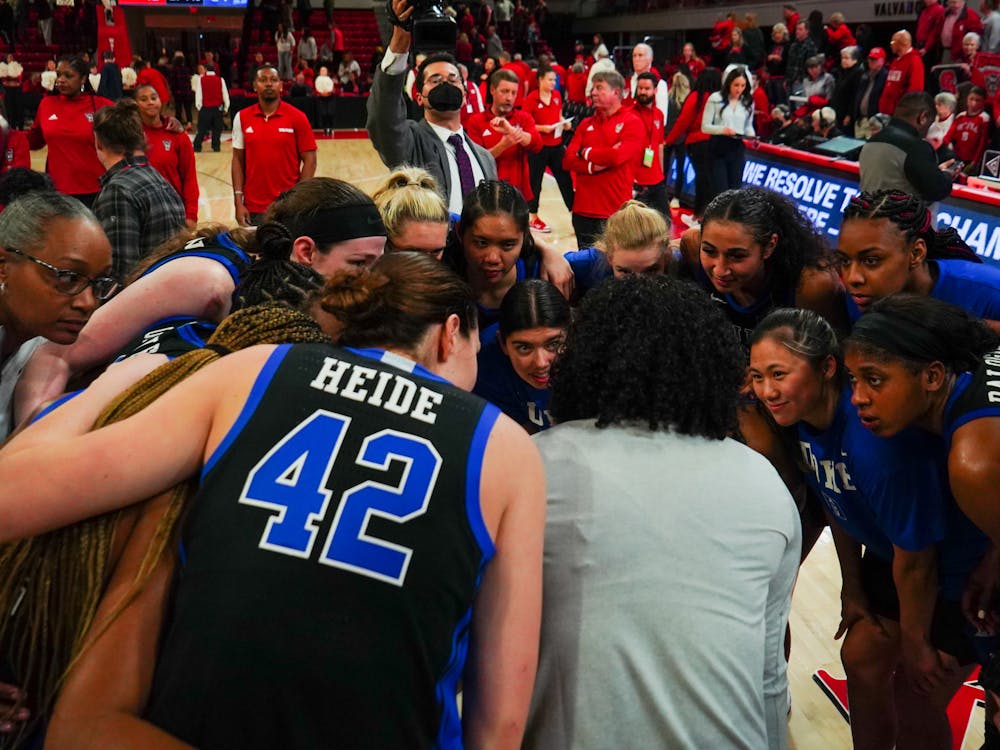 Kara Lawson huddles with her team during a December 2022 win at N.C. State — before Duke cracked the AP Top 25.