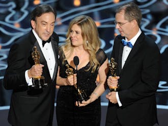 HOLLYWOOD, CA - MARCH 02:  (L-R) Producer Peter Del Vecho, directors Jennifer Lee and Chris Buck accept the Best Animated Feature Film award for 'Frozen' onstage during the Oscars at the Dolby Theatre on March 2, 2014 in Hollywood, California.  (Photo by Kevin Winter/Getty Images)