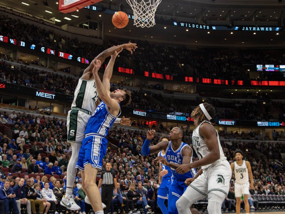 Duke's Ryan Young contests Michigan State's Mady Sissoko at the rim. 