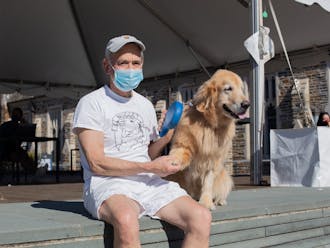 Even in a pandemic, Keith Upchurch, Trinity ‘72, and Nugget, his 10-year-old golden retriever, have kept coming to campus to see students.&nbsp;