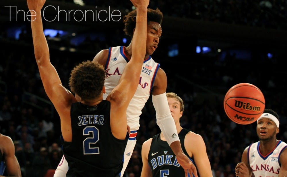 <p>Devonte' Graham had nine key first-half points to keep the Jayhawks close while their best players were in foul trouble.&nbsp;</p>