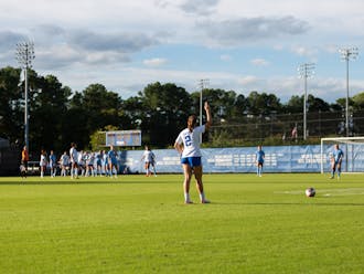 Kat Rader stands over a free kick against North Carolina.