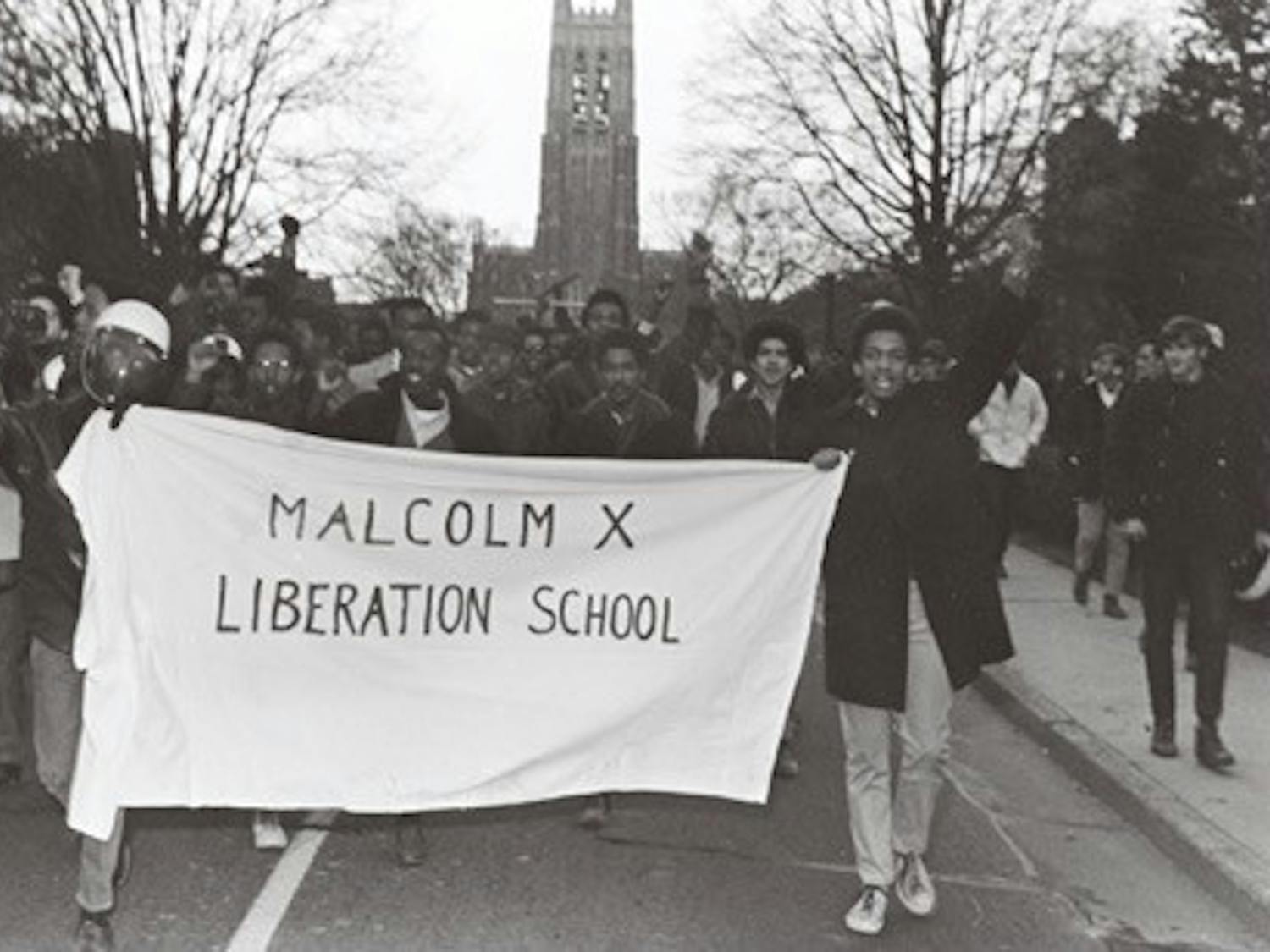The protesters renamed the Allen Building the Malcolm X Liberation School in solidarity with protests around the country. After vacating the Allen Building, the protesters and their supporters walked down Chapel Drive. Courtesy of the Durham Civil Rights Heritage Project (The Herald Sun).
