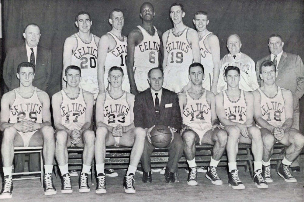 Brooke's grandfather, Tommy (third from right, standing) played alongside five-time NBA MVP Bill Russell (center, standing) as well as under the leadership of legendary coach Red Auerbach (center, sitting).