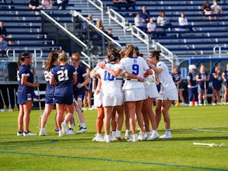 Duke players huddle during a Feb. 10 win against Navy.