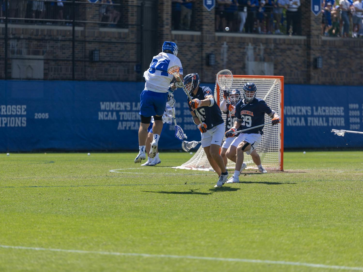 Senior attack Brennan O'Neill fires a shot for Duke men's lacrosse against Virginia.