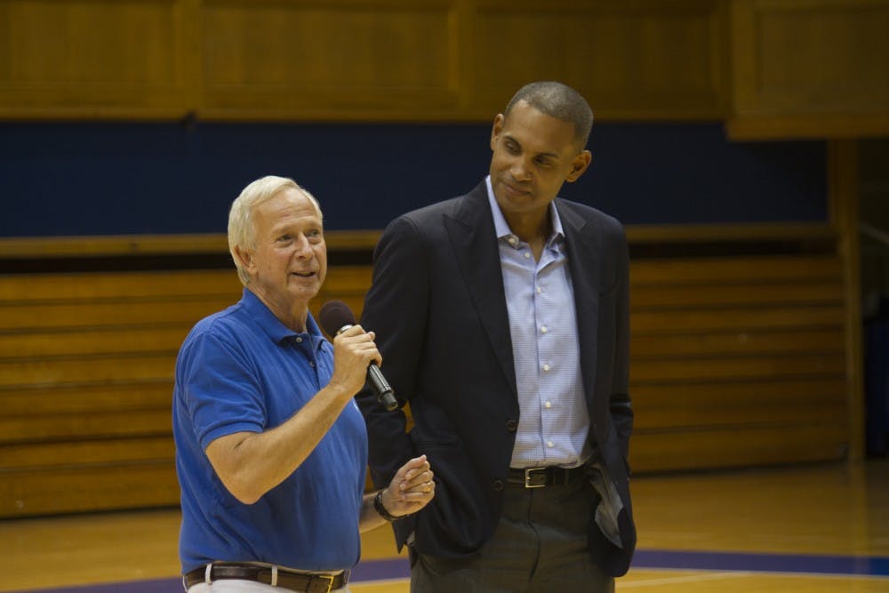 President Richard Brodhead and former Blue Devil and National Player of the Year Grant Hill address the senior class before the game.