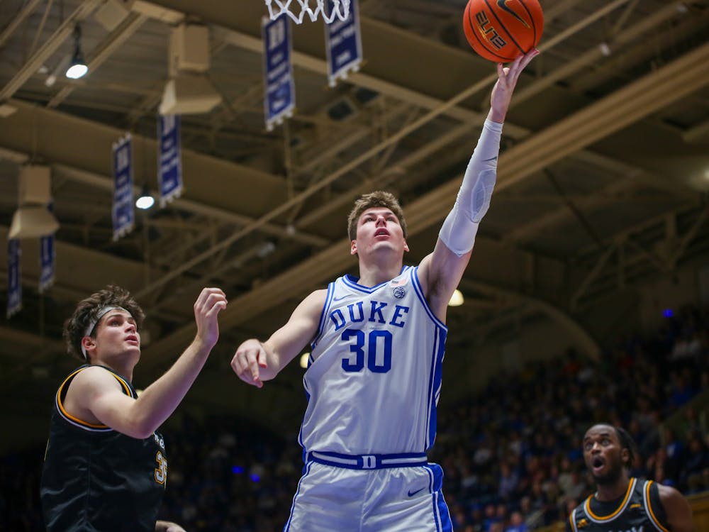 Kyle Filipowski lays the ball in during Duke's Tuesday win against La Salle.