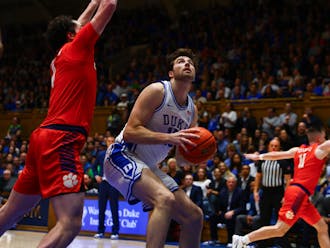 Graduate center Ryan Young attempts a layup in Duke's game against Clemson.