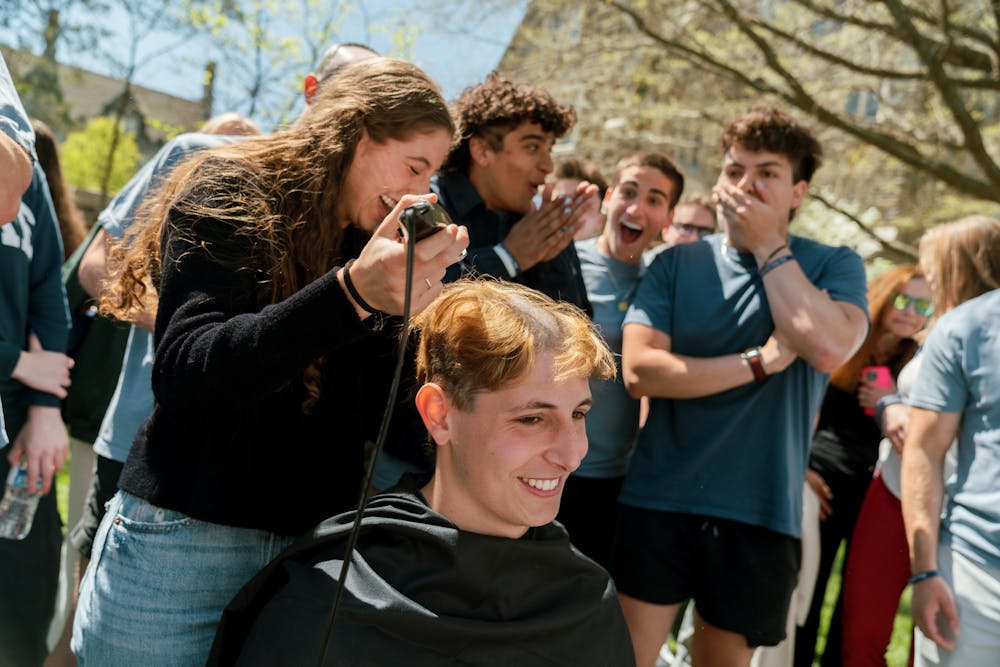 <p>Junior Jack Erens getting his head shaved.</p>