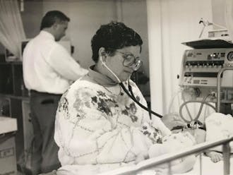 Dr. Brenda Armstrong examining a patient. Oct. 21, 1992 | Photo by Jason Laughlin