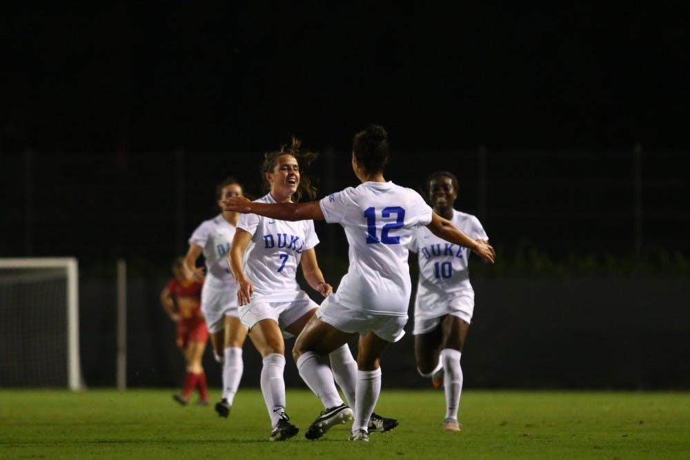 Freshman Kayla McCoy (12) scored the lone goal of the game on a pass from classmate Taylor Racioppi to send Duke past the No. 15 Trojans Friday night.