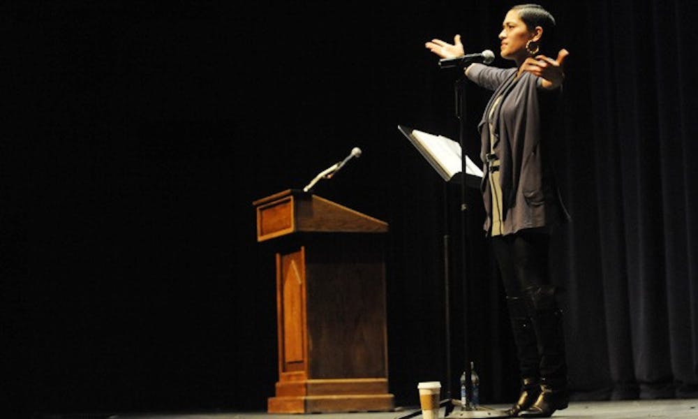 Poet Mayda del Valle addresses a Reynolds Theater audience Monday night, discussing themes of famiy, relationships and bad pick-up lines. Del Valle said that  “off-limit” subjects are often the most captivating.