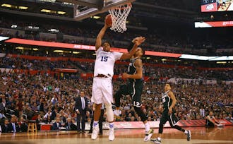 Jahlil Okafor had 18 points and six rebounds to lead the Blue Devils past Michigan State and into Monday's national title game.