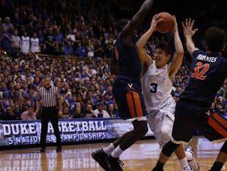 Grayson Allen powered through strong defense by Marial Shayok to get off his game-winner before time expired.