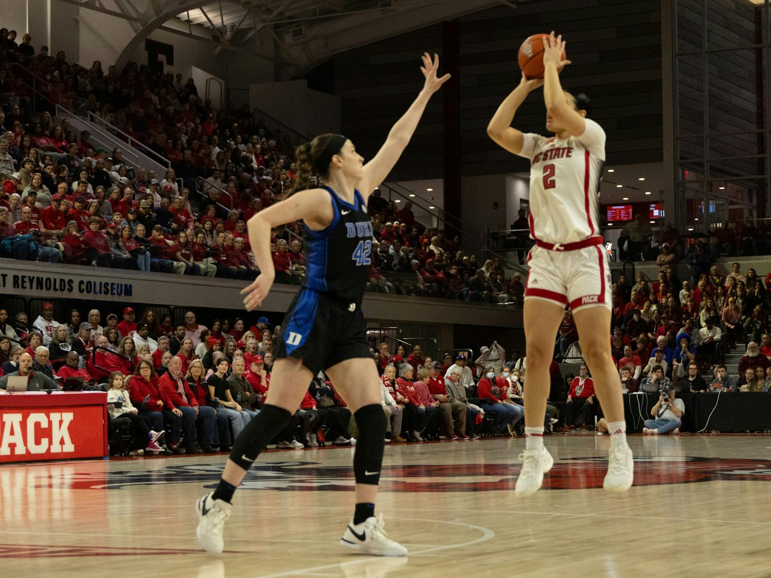 Kennedy Brown attempts to block a shot during Duke's Sunday afternoon loss to N.C. State.