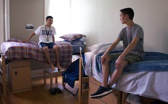 Soren Christensen, right, met his roommate through the random assignment process.