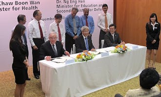 Administrators from Duke University and National University of Singapore sign an agreement for Duke-NUS, which is now entering phase two.