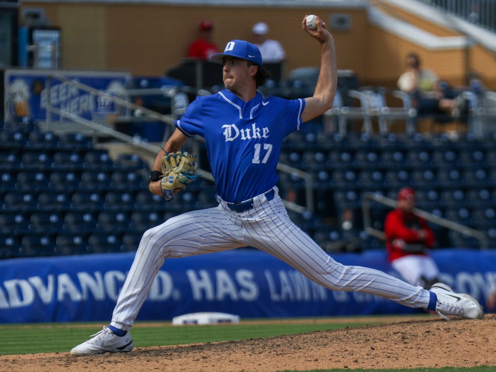 <p>Freshman James Tallon winds up for the pitch against Louisville.</p>