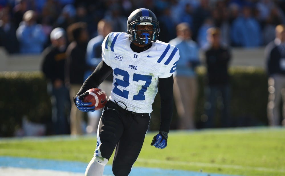 Redshirt freshman DeVon Edwards returned a kickoff for a touchdown and added a crucial interception to seal Duke's Coastal Division championship.