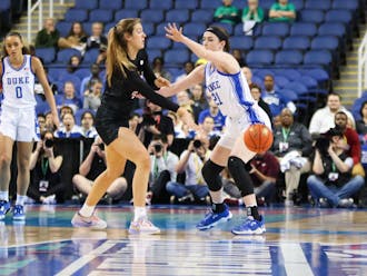 Duke's Kennedy Brown defends ACC Player of the Year Elizabeth Kitley of the Hokies.