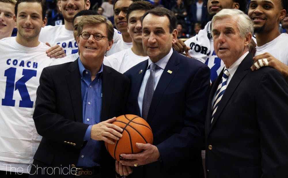 <p>Coach Mike Krzyzewski celebrated his 1,000th win at Duke alongside his team, receiving a game ball from President Vincent Price and Director of Athletics Kevin White.</p>