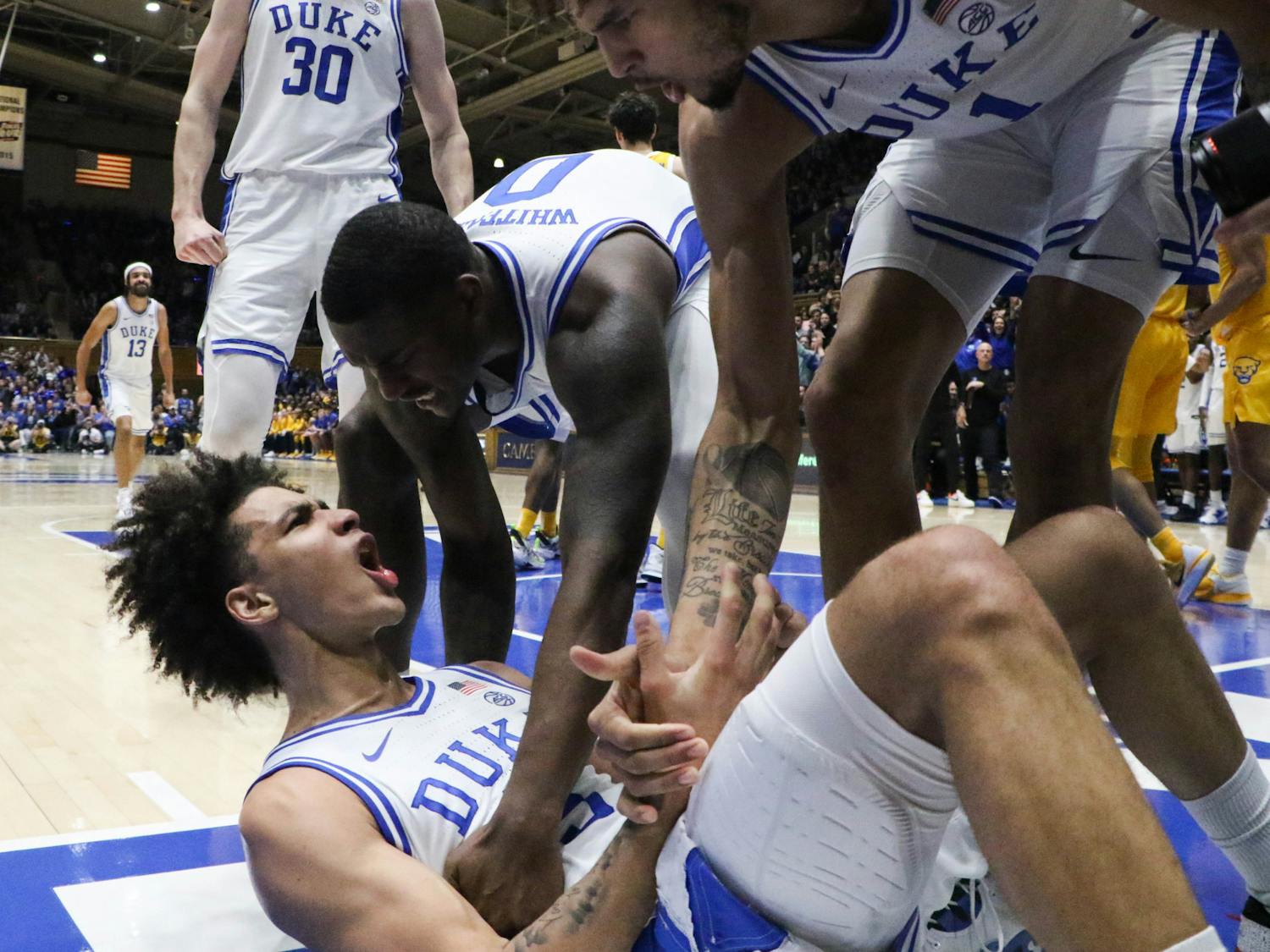 Duke players rejoice with Tyrese Proctor after a bucket during the 15-0 second-half run that changed the game for good.