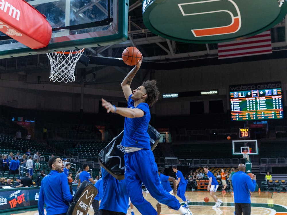 Tyrese Proctor warms up before Duke's game against Miami.