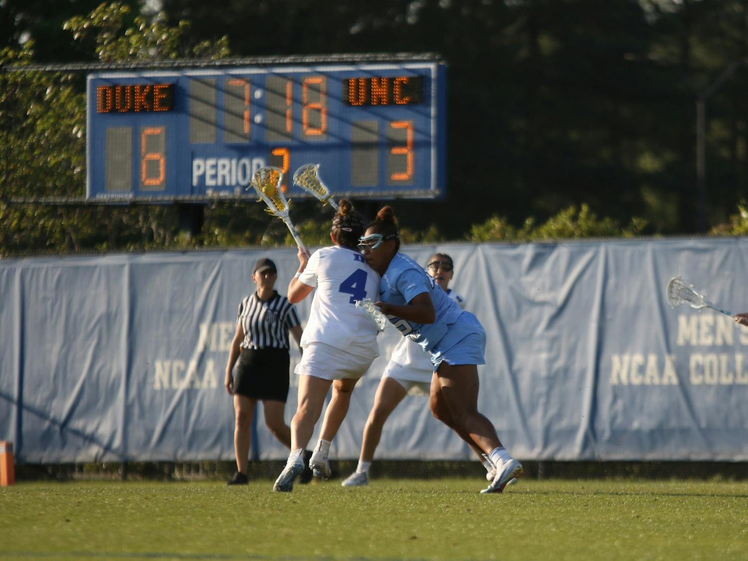 Junior attacker Katie DeSimone fends off a defender in Duke's regular season finale against North Carolina.