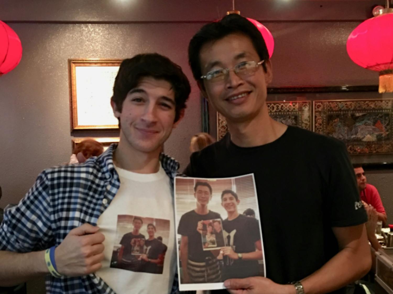 Besner (left) poses with waiter Peter Chung (right).