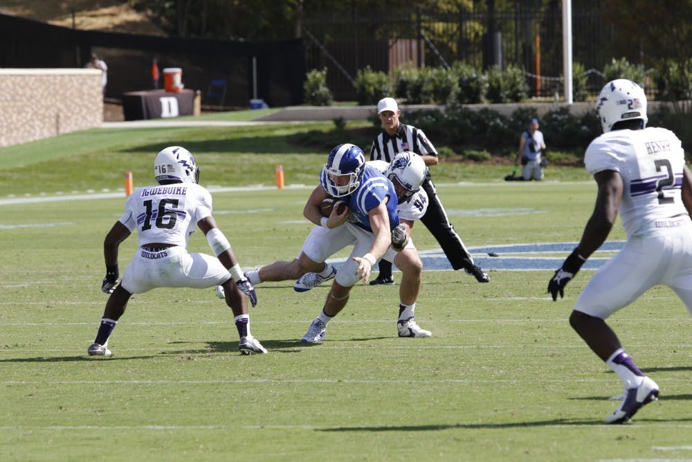 With the Blue Devils reluctant to attempt deep throws downfield, Northwestern bottled up Duke's underneath game Saturday, making life difficult for quarterback Thomas Sirk.