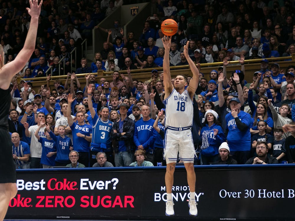 Graduate forward Mason Gillis lines up for a corner three.