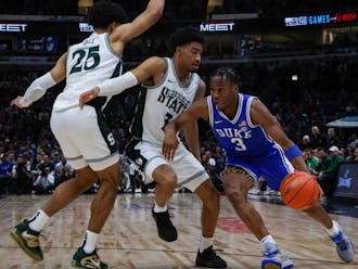Senior guard Jeremy Roach drives to the basket against Michigan State Tuesday night.