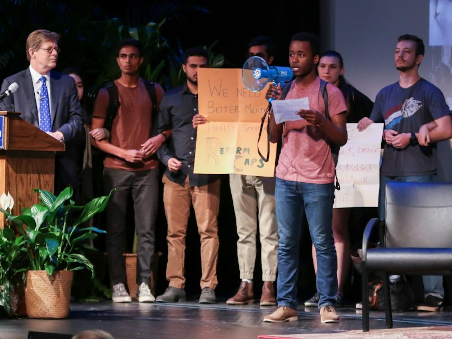 Students protest during alumni event