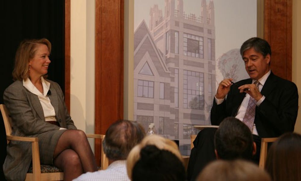 John Harwood (right), chief Washington correspondent for CNBC, interviews neurosurgeon Gail Rosseau (left) on health care reform Saturday. Rosseau pushed for reducing medical costs and increasing medical literacy in the U.S.