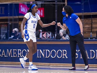 Lawson, pictured here with Jaida Patrick, made history Wednesday afternoon as Duke basketball's first Black head coach.