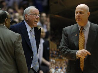 Current ESPN analyst and former Virginia Tech head coach Seth Greenberg (right) explains what may have been running through the head of Syracuse head coach Jim Boeheim (left) when he got ejected from his team's loss to Duke Saturday.