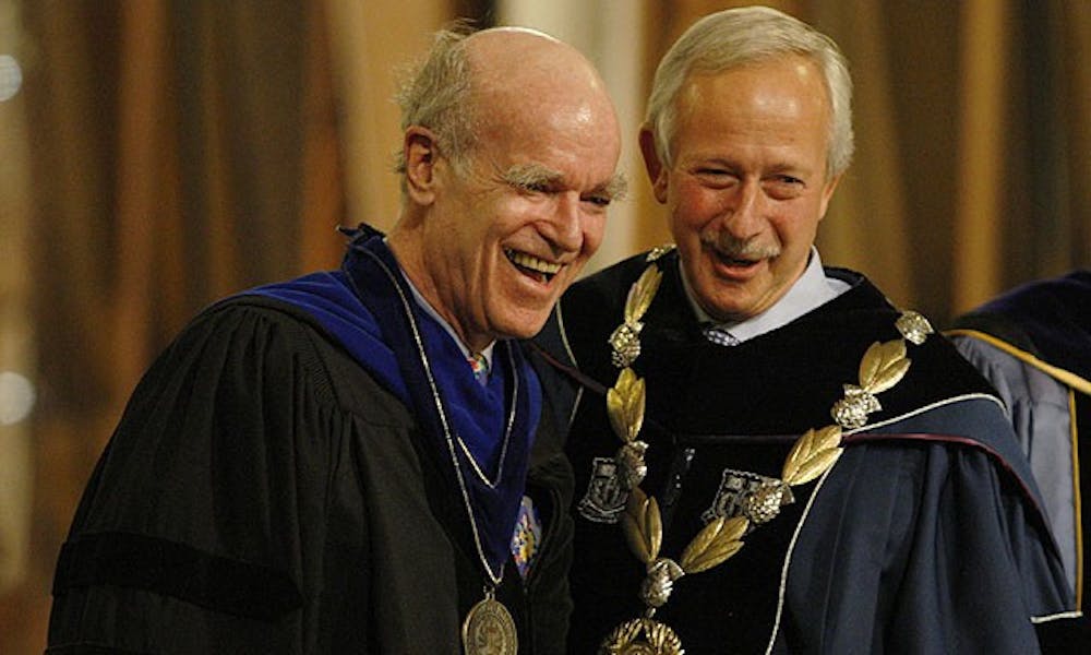 Professor Joel Fleishman (left) receives the University Medal for Distinguished Service from President Richard Brodhead (right) during the Founder’s Day Convocation in the Chapel Thursday.