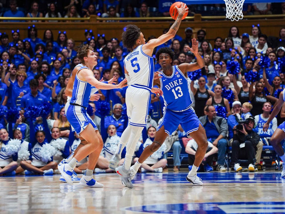 Tyrese Proctor (5) lifts the ball over his defenders during Countdown to Craziness.