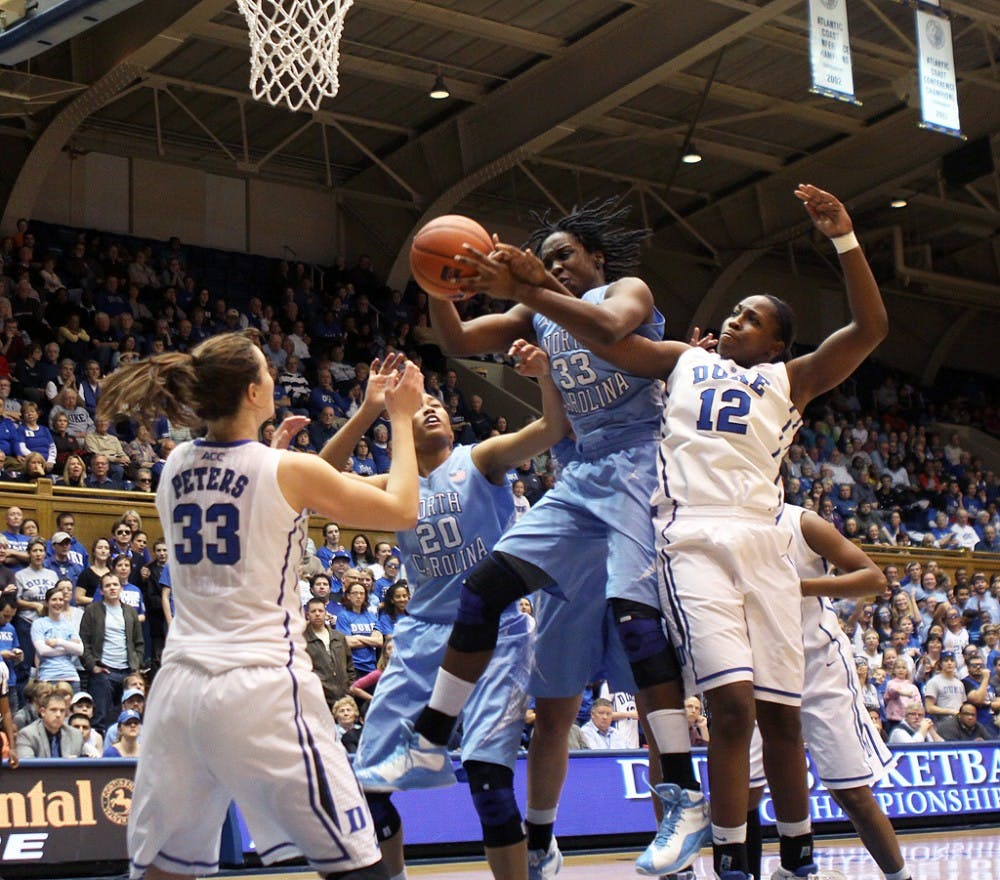 Chelsea Gray battles for a rebound during the first half. Duke handily defeated the University of North Caroline 96-56