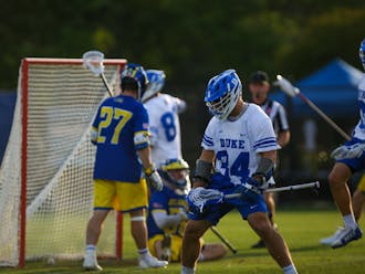 Junior attackman Brennan O'Neill celebrates during Duke's opening-round game against Delaware.
