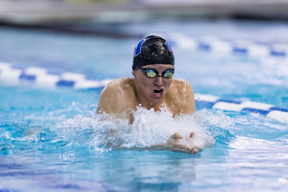 Junior Cole Reznick swam his way into the record books this past weekend.