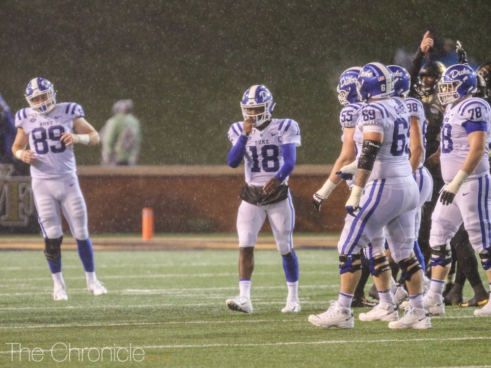 Duke quarterback Quentin Harris fought through a constant downpour in the first half against Wake Forest.