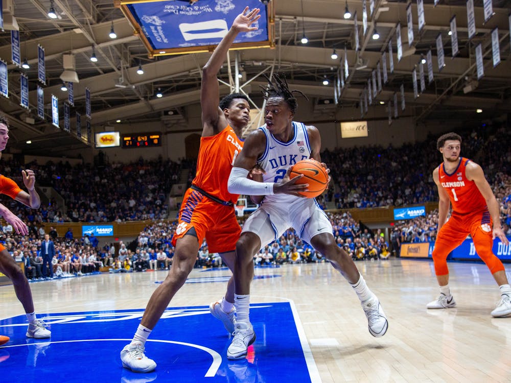 <p>Mark Mitchell backs down a Clemson defender during Duke's Saturday victory at Cameron Indoor Stadium.</p>