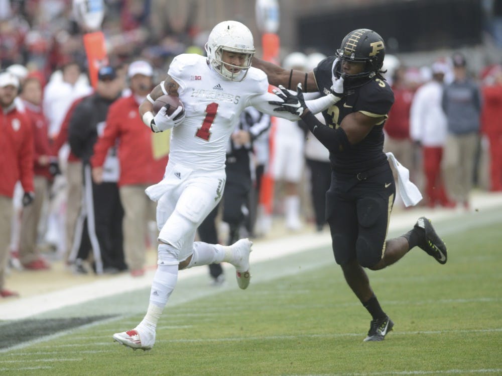 Wide receiver Simmie Cobbs, Jr. runs down and attempts to pass Purdue safety Leroy Clark on Nov. 28 at Ross-Ade Stadium. The Hoosiers won 54-36.