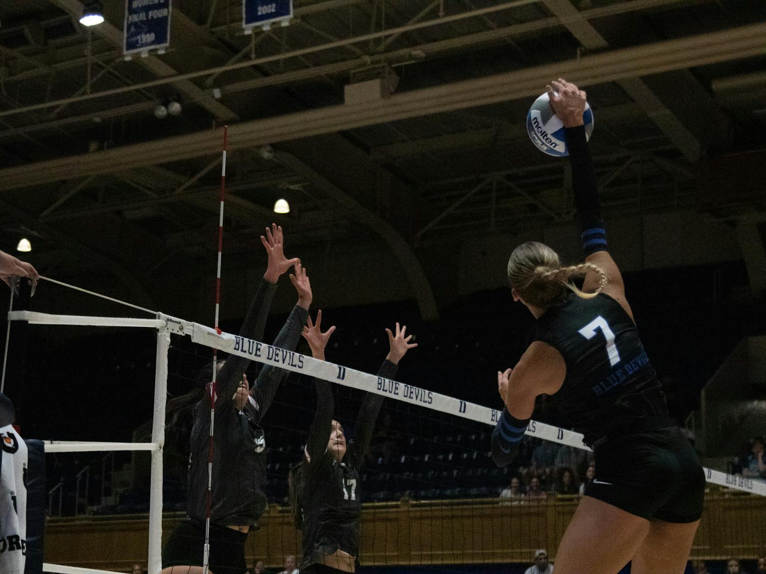 Graduate student Gracie Johnson leaps up to hit the ball during Duke's match with Santa Clara.