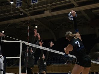 Graduate student Gracie Johnson leaps up to hit the ball during Duke's match with Santa Clara.